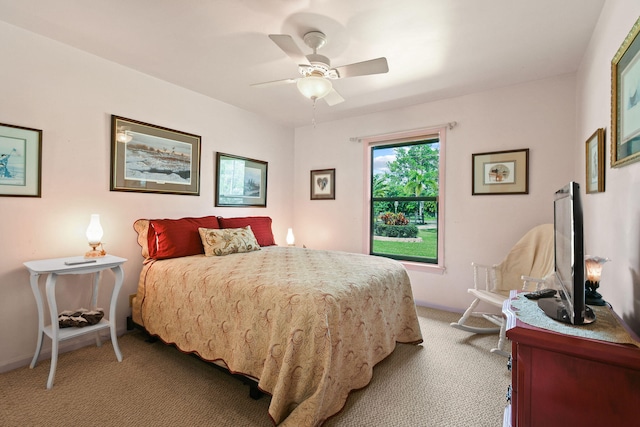 bedroom with ceiling fan and light colored carpet