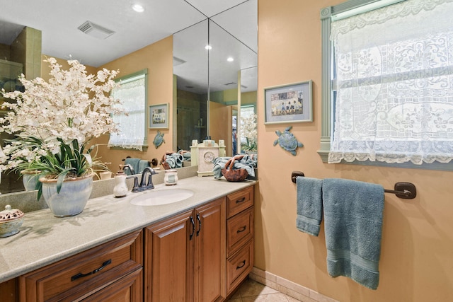 bathroom with vanity and tile patterned flooring