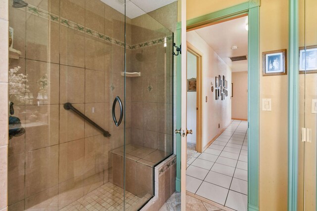 12390 Sandy Run, Jupiter, FL 33478 - bathroom featuring a stall shower and tile patterned flooring