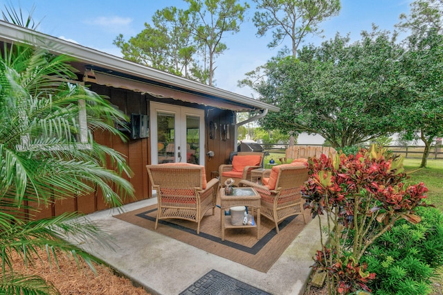 view of patio / terrace featuring an outdoor living space and french doors