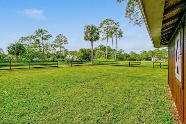 view of yard with a rural view