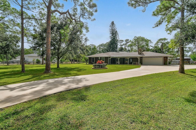 ranch-style house with a front lawn and a garage