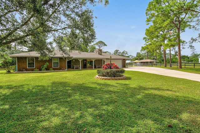 single story home with a garage and a front yard