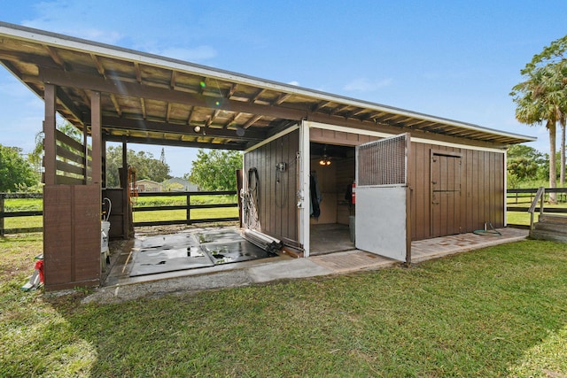 view of outdoor structure featuring a yard