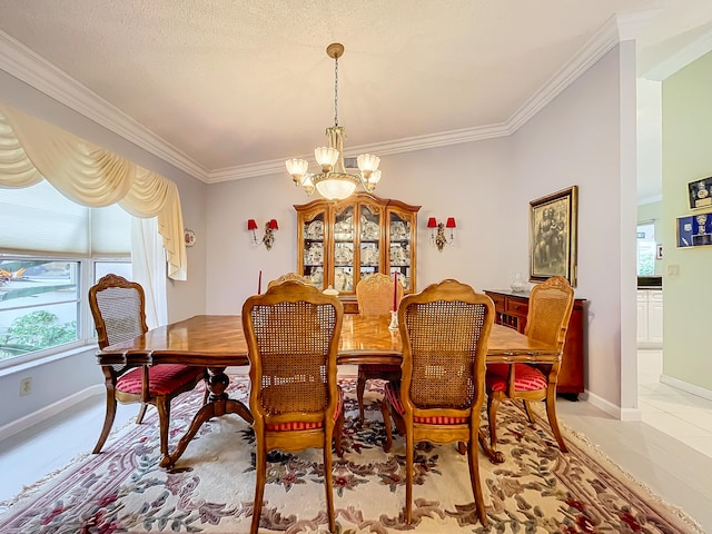 tiled dining space with a textured ceiling, a chandelier, and ornamental molding