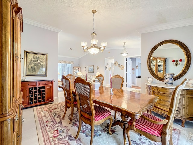 dining area featuring a textured ceiling, lofted ceiling, a chandelier, and ornamental molding