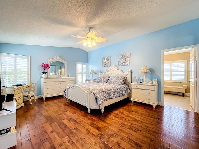 bedroom with ceiling fan, hardwood / wood-style flooring, multiple windows, and lofted ceiling