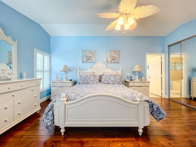 bedroom with hardwood / wood-style floors, ceiling fan, a closet, and a textured ceiling