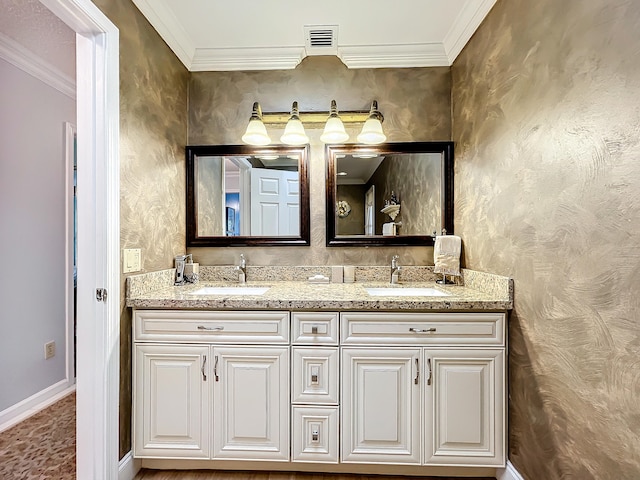 bathroom featuring ornamental molding and vanity