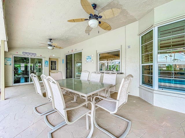 view of patio featuring ceiling fan