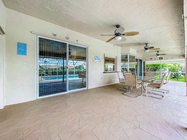 view of patio featuring ceiling fan