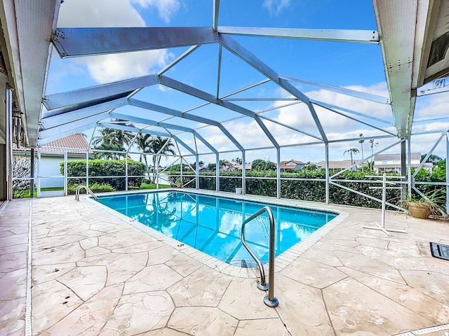 view of pool featuring a patio area and a lanai