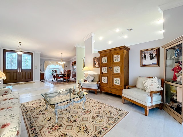 interior space with crown molding, a chandelier, and light tile patterned floors