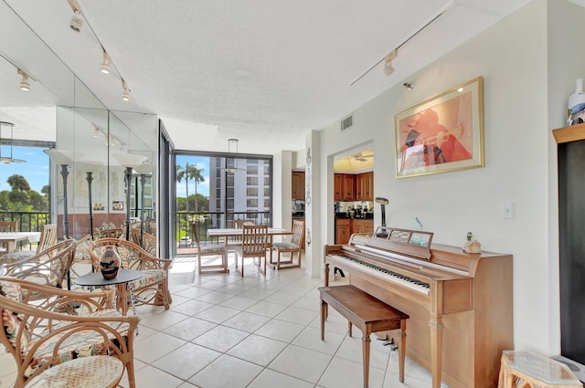 6875 Willow Wood Dr Unit 2032, Boca Raton, FL 33434 - interior space with a healthy amount of sunlight, light tile patterned floors, floor to ceiling windows, and a textured ceiling