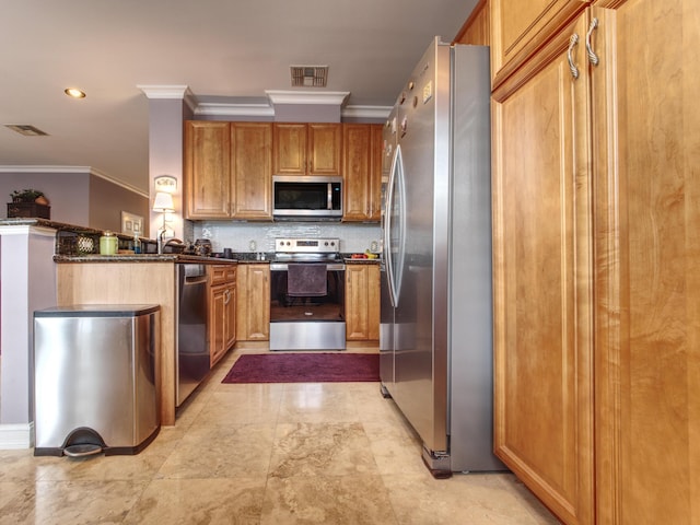 kitchen with ornamental molding, backsplash, stainless steel appliances, and dark stone counters