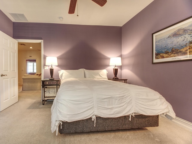 bedroom with ceiling fan and light colored carpet