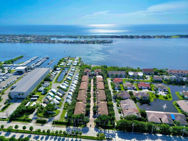 birds eye view of property featuring a water view and a residential view