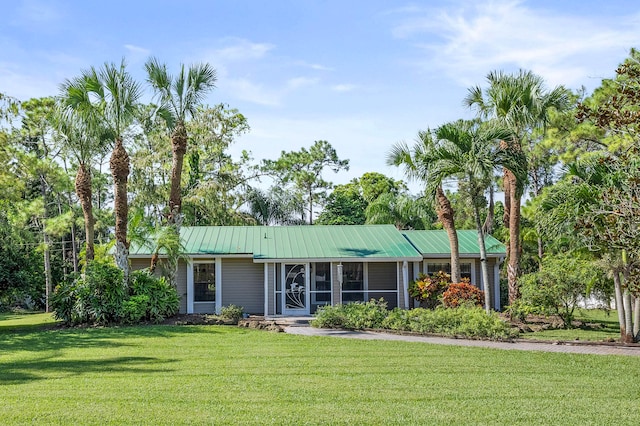 single story home with a front lawn