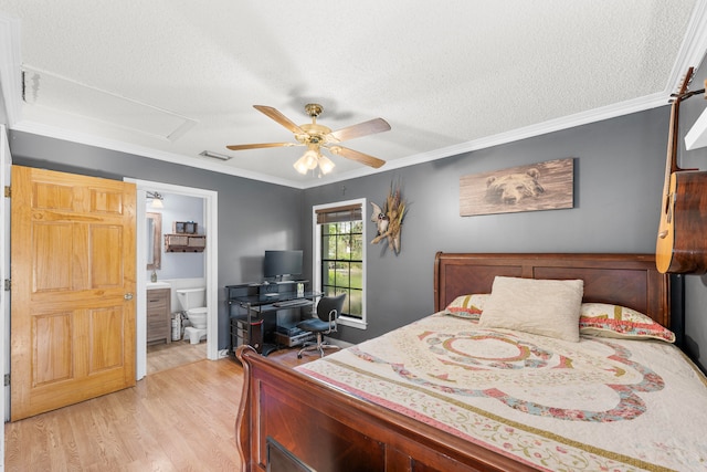 bedroom with light hardwood / wood-style floors, ceiling fan, ornamental molding, connected bathroom, and a textured ceiling