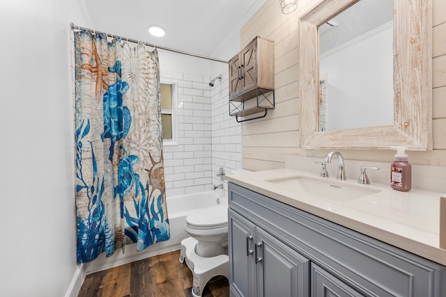 full bathroom featuring crown molding, toilet, wood-type flooring, shower / tub combo, and vanity