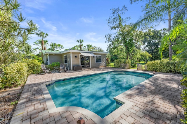 view of pool featuring a patio