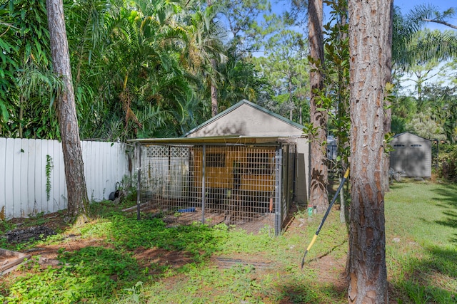 view of outbuilding featuring a lawn