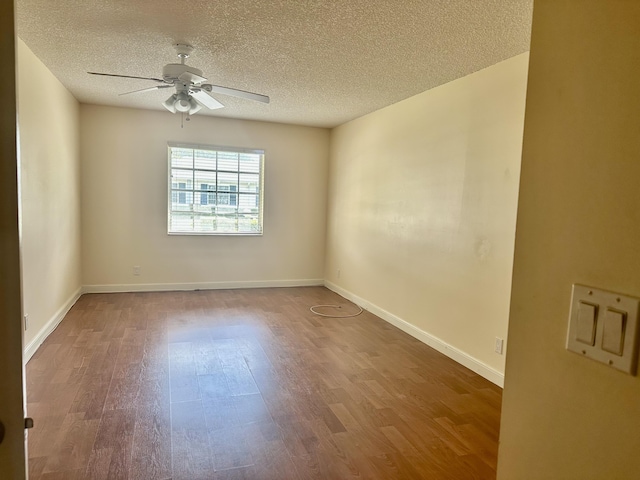 empty room featuring wood-type flooring, a textured ceiling, and ceiling fan