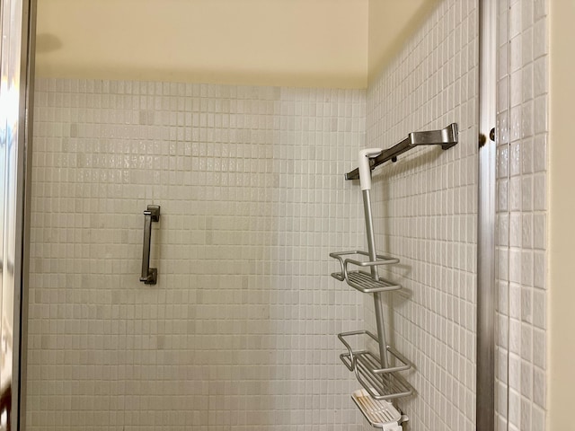 bathroom with a tile shower