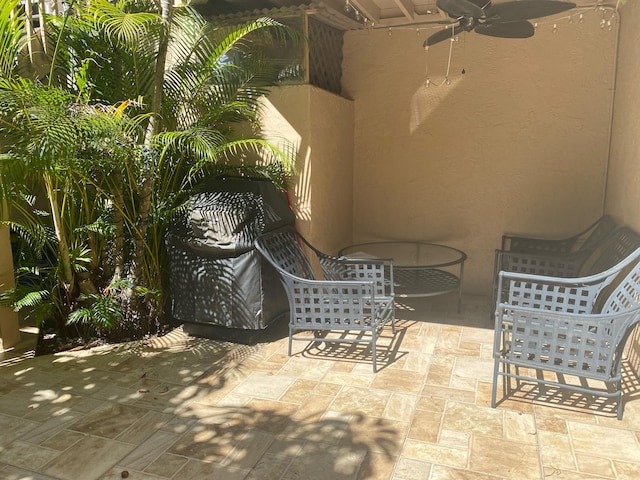 view of patio / terrace featuring ceiling fan