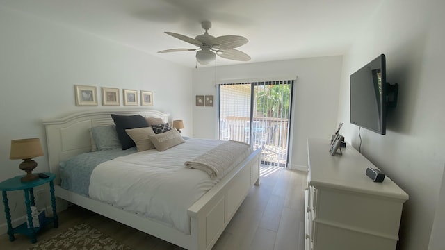 bedroom featuring ceiling fan, hardwood / wood-style flooring, and access to outside