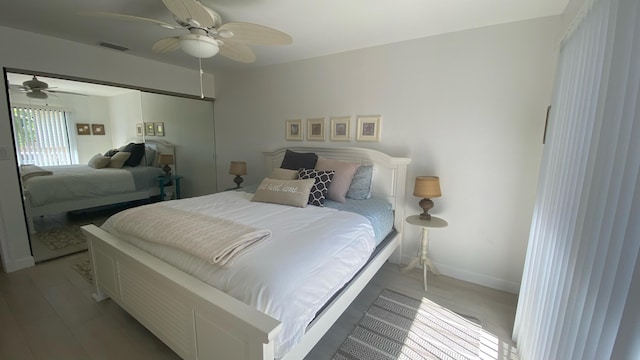 bedroom with hardwood / wood-style flooring and ceiling fan