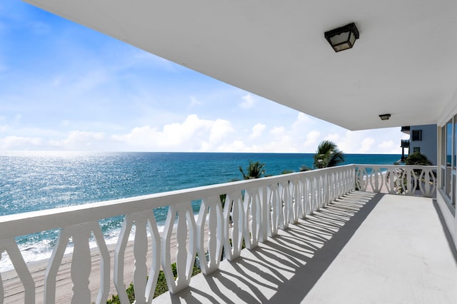 balcony featuring a water view