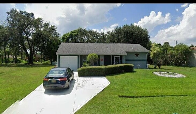 single story home featuring a garage and a front lawn