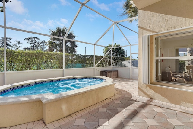 view of pool with a lanai and a patio area