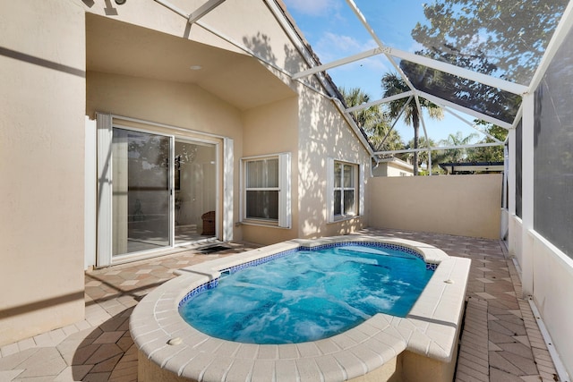 view of pool with a lanai and a patio area