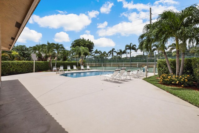 view of swimming pool featuring a patio area