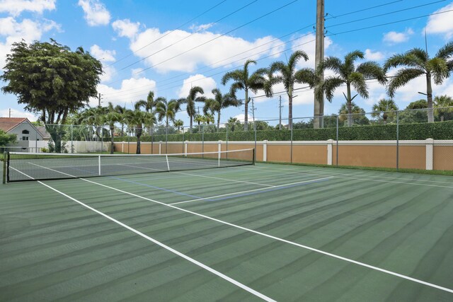 view of sport court with a community pool