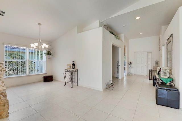 interior space with light tile patterned floors, vaulted ceiling, and a notable chandelier