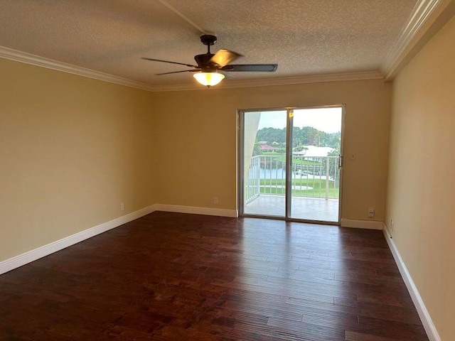 spare room with ceiling fan, dark wood-type flooring, a textured ceiling, and crown molding