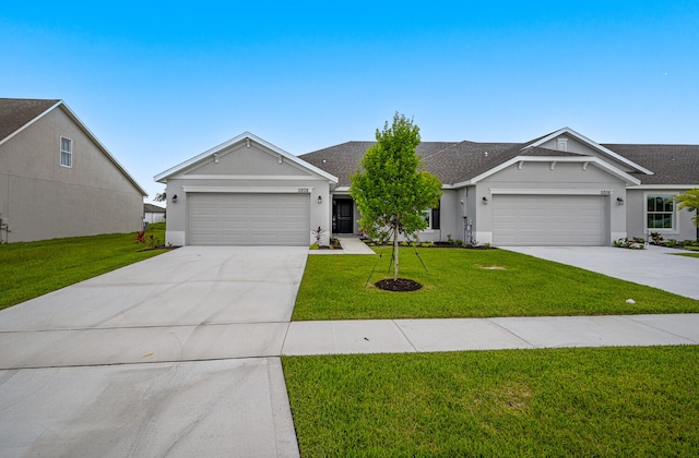 5145 Modeno St, Fort Pierce, FL 34951 - ranch-style house featuring a garage and a front lawn