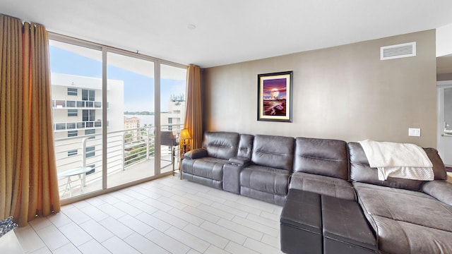 living room with floor to ceiling windows