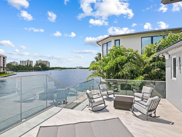 view of patio / terrace featuring a water view and outdoor lounge area