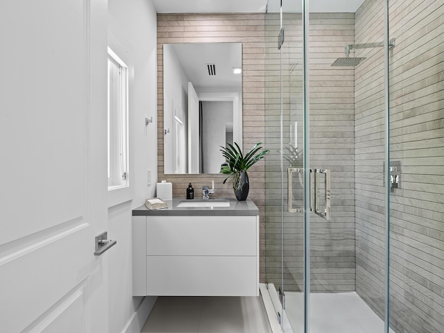 full bath featuring a stall shower and vanity