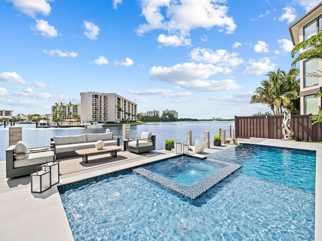 view of swimming pool featuring a patio, outdoor lounge area, a water view, and a pool with connected hot tub