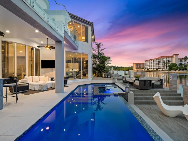 pool featuring ceiling fan, an in ground hot tub, a patio area, and an outdoor living space