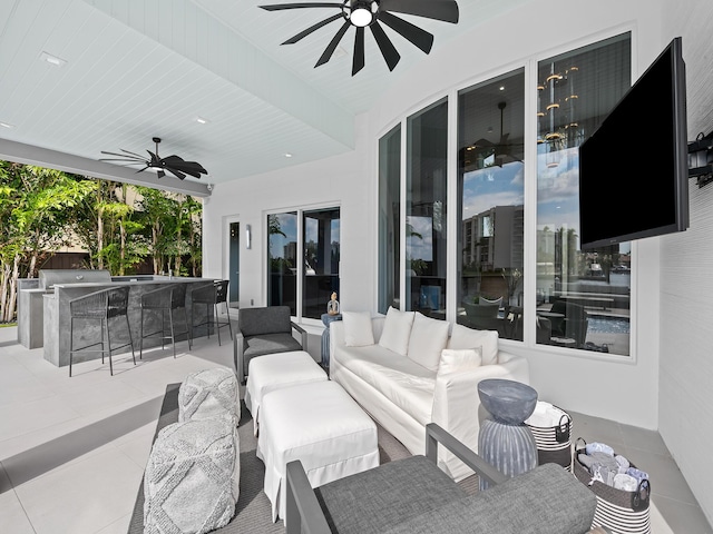 view of patio / terrace featuring a ceiling fan, outdoor wet bar, and an outdoor hangout area