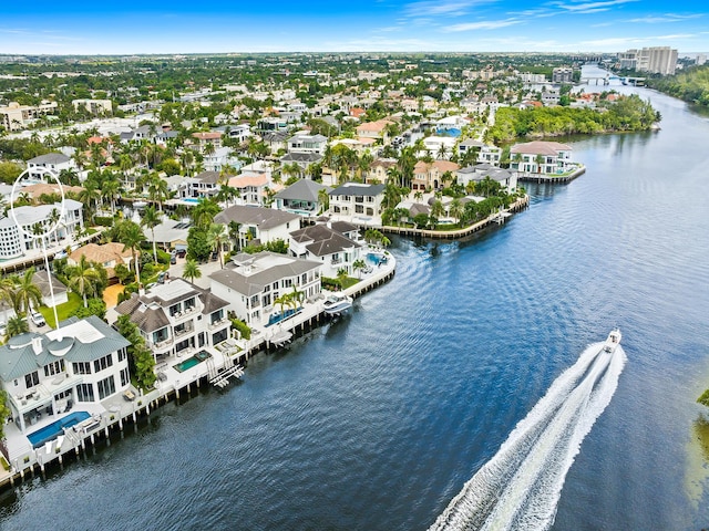 drone / aerial view featuring a residential view and a water view