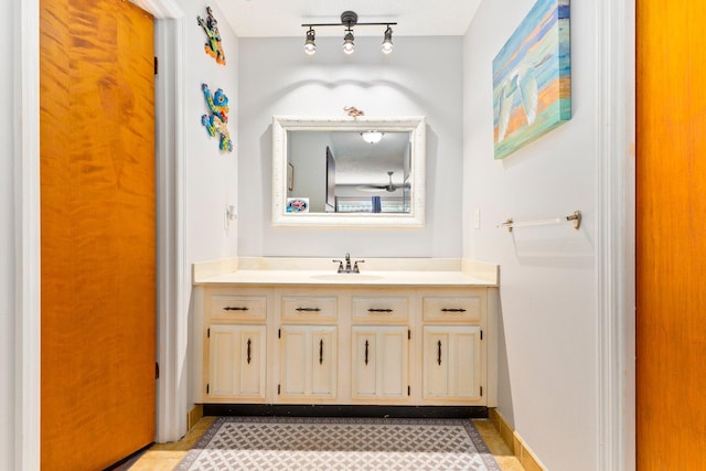 bathroom featuring vanity, tile patterned floors, and a textured ceiling