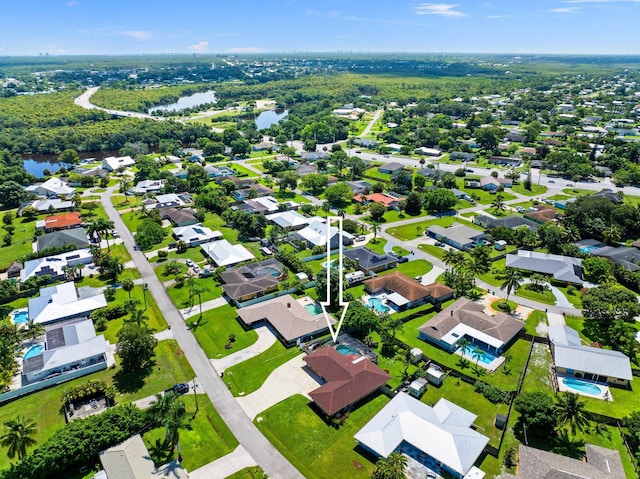 bird's eye view with a water view