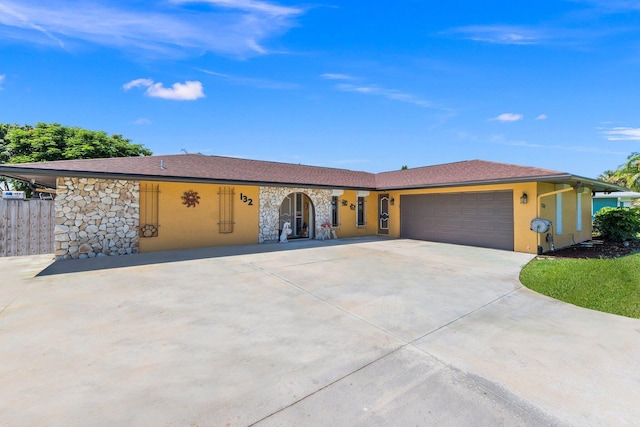 single story home featuring a garage